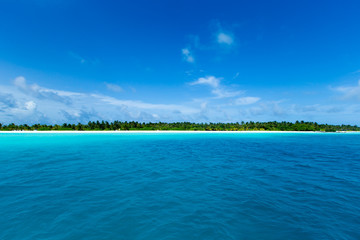  Maldives island with white sandy beach and sea