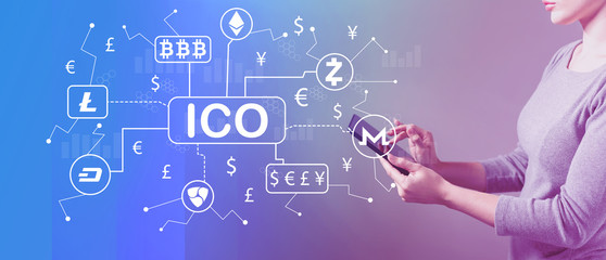 Cryptocurrency ICO theme with business woman using a tablet computer 