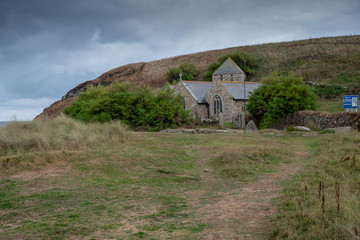 Fototapeta na wymiar Parish Church of St Winwaloe named also the Church of the Stormes in Gunwalloe, Cornwall