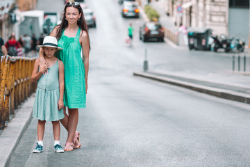 Happy mom and little adorable girl traveling in Rome, Italy