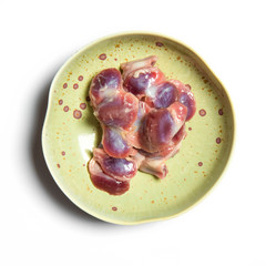 Chicken Gizzard on a plate isolated on white background.