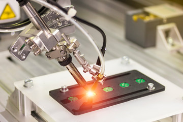automation robot point soldering for assembly electric circuit board (PCB)  at factory