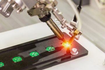 automation robot point soldering for assembly electric circuit board (PCB)  at factory