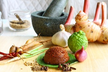 hai red curry paste with fresh ingredients and mortar