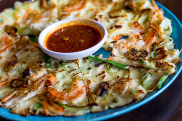 Seafood pancake with shrimp and spring onion and sauce