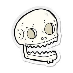 sticker of a cartoon spooky skull