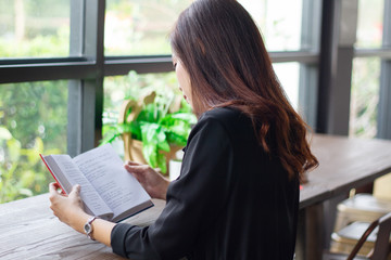 Asian woman reading a book for relaxation time