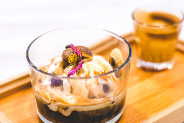 Affogato with expresso and vanilla ice cream and edible flowers