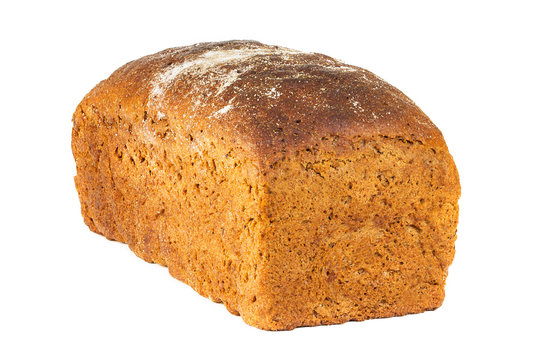 A traditional black square loaf of bread is isolated on a white background. Rye bread isolated on a white background.