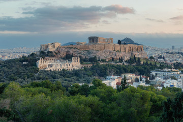 Panorama view on the Acropolis in Athens at sunrise. Scenic travel background with dramatic clouds. Greece