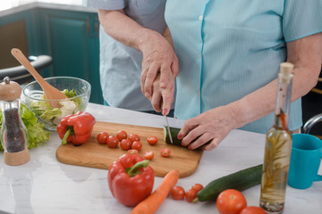 Romantic old couple cooking