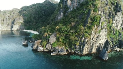 Aerial drone shot of high mountain covered with tropical forest. Tropical landscape. Travel concept Philippines,El Nido.