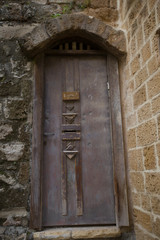 Old, wooden door beautifully decorated.