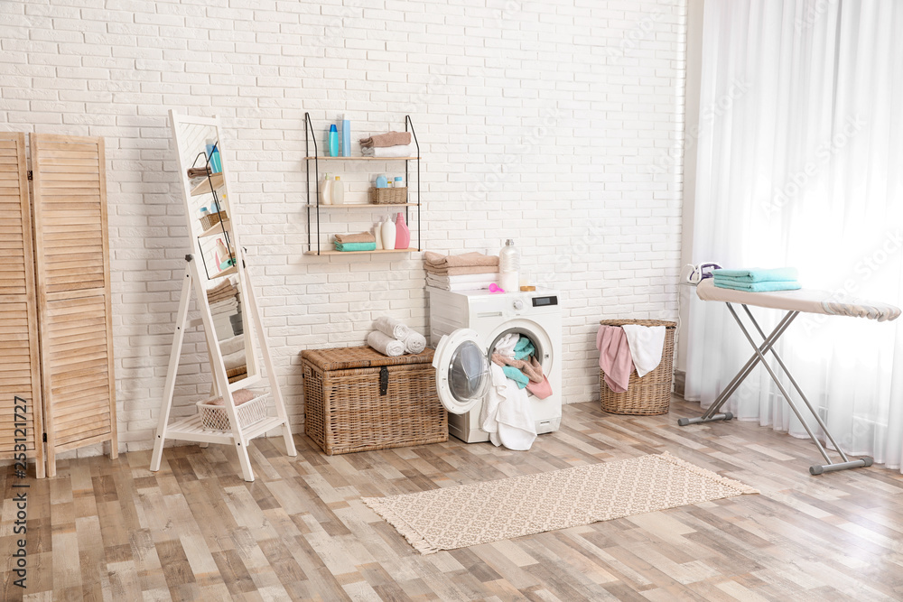 Sticker Bathroom interior with dirty towels in washing machine