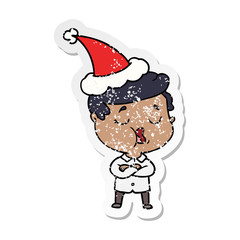 distressed sticker cartoon of a man talking wearing santa hat