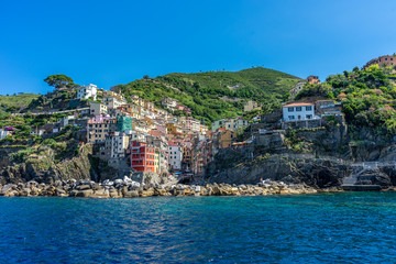 The cityscape of Riomaggiore viewed from the sea, Cinque Terre, Italy, Riviera