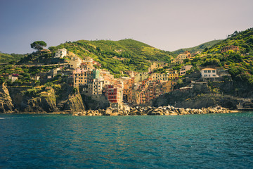 The cityscape of Riomaggiore viewed from the sea, Cinque Terre, Italy, Riviera