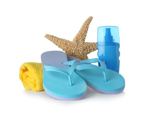 Composition with beach accessories on white background