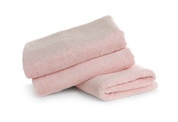 Stack of clean soft towels on white background