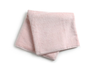 Folded soft terry towel on white background, top view