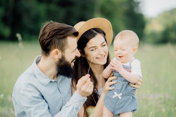 Fototapeta premium happy family on a spring picnic