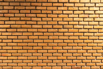 orange grunge brick wall background texture at thailand