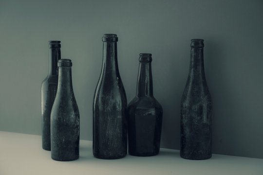 Antique glass bottles in a row
