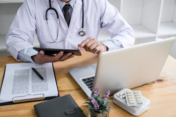 Fototapeta premium Health care and Medical concept, doctor checking patient history form while think about finding a cure for a diagnosis, treatment methods to rehabilitate the body recommend treat of patient