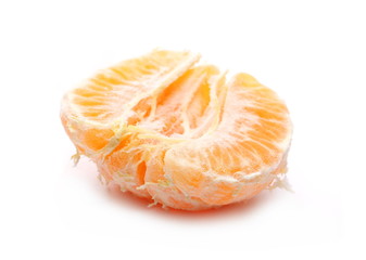 Tangerine or clementine half isolated on white background