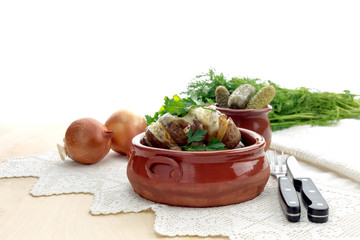 The scalloped potatoes and pickles close-up