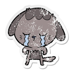 distressed sticker of a cartoon crying dog