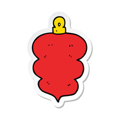 sticker of a cartoon christmas bauble