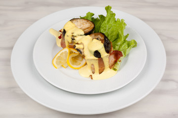 Eggplant and bacon rolls with cheese, lemon and green salad.