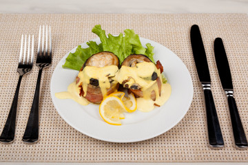 Eggplant and bacon rolls with cheese, lemon and green salad.