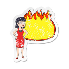retro distressed sticker of a cartoon woman in dress with hands on hips and flame banner