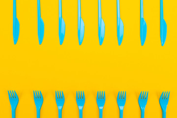 Colorful set of vibrant forks and knife isolated on black