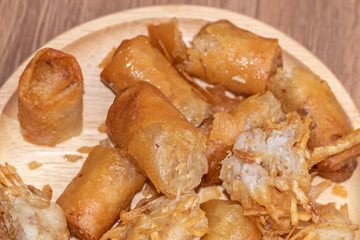 Obraz na płótnie Canvas taro Deep fried spring roll on wooden plate