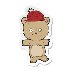 sticker of a cartoon bear in hat