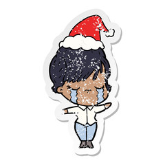 distressed sticker cartoon of a woman crying wearing santa hat