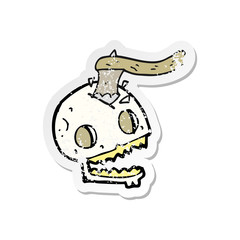 retro distressed sticker of a cartoon axe in skull