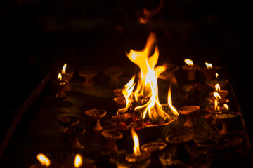 sacred flame on the altar in the dark time of Diwali festival