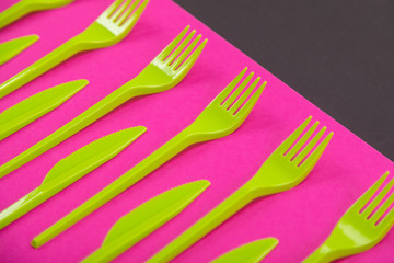 Colorful set of plastic table ware isolated on background