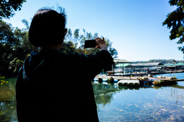 Asian woman stand near the lake