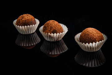 row of three useful handmade round chocolate candies