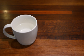 coffee cup on the wood table close up