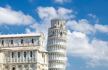 Fototapeta na wymiar Pisa Cathedral Duomo Cattedrale and Leaning Tower Torre on Piazza del Miracoli square, blue sky with white clouds background in sunny day, Tuscany, Italy