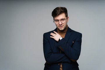attractive man dressed casual wearing glasses - studio shot, copy space.