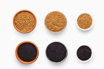 Different sized bowls with fenugreek and black sesame on white