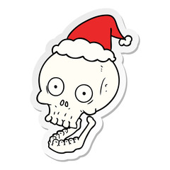 sticker cartoon of a skull wearing santa hat