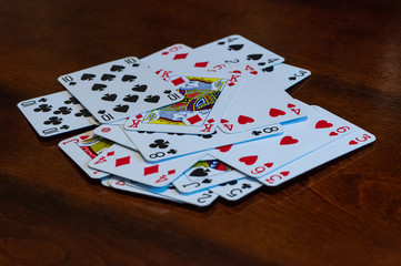 Playing cards on wooden table